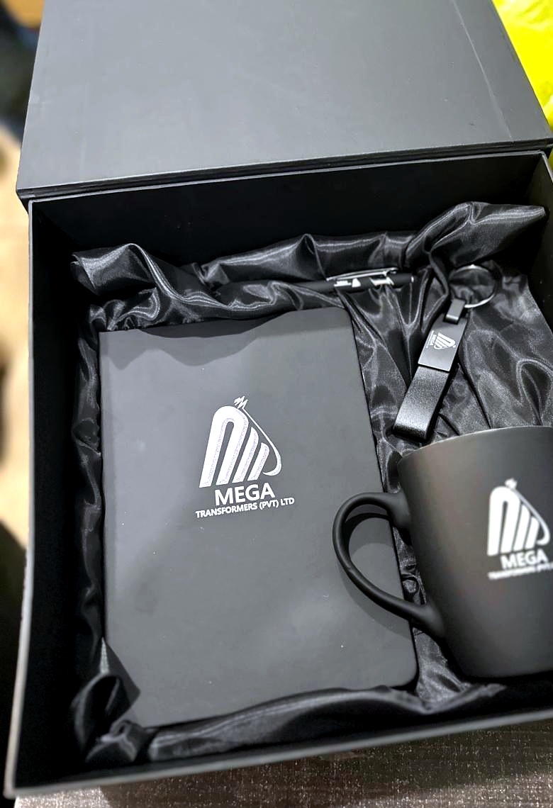 Corporate gift box with notebook, mug and keychain